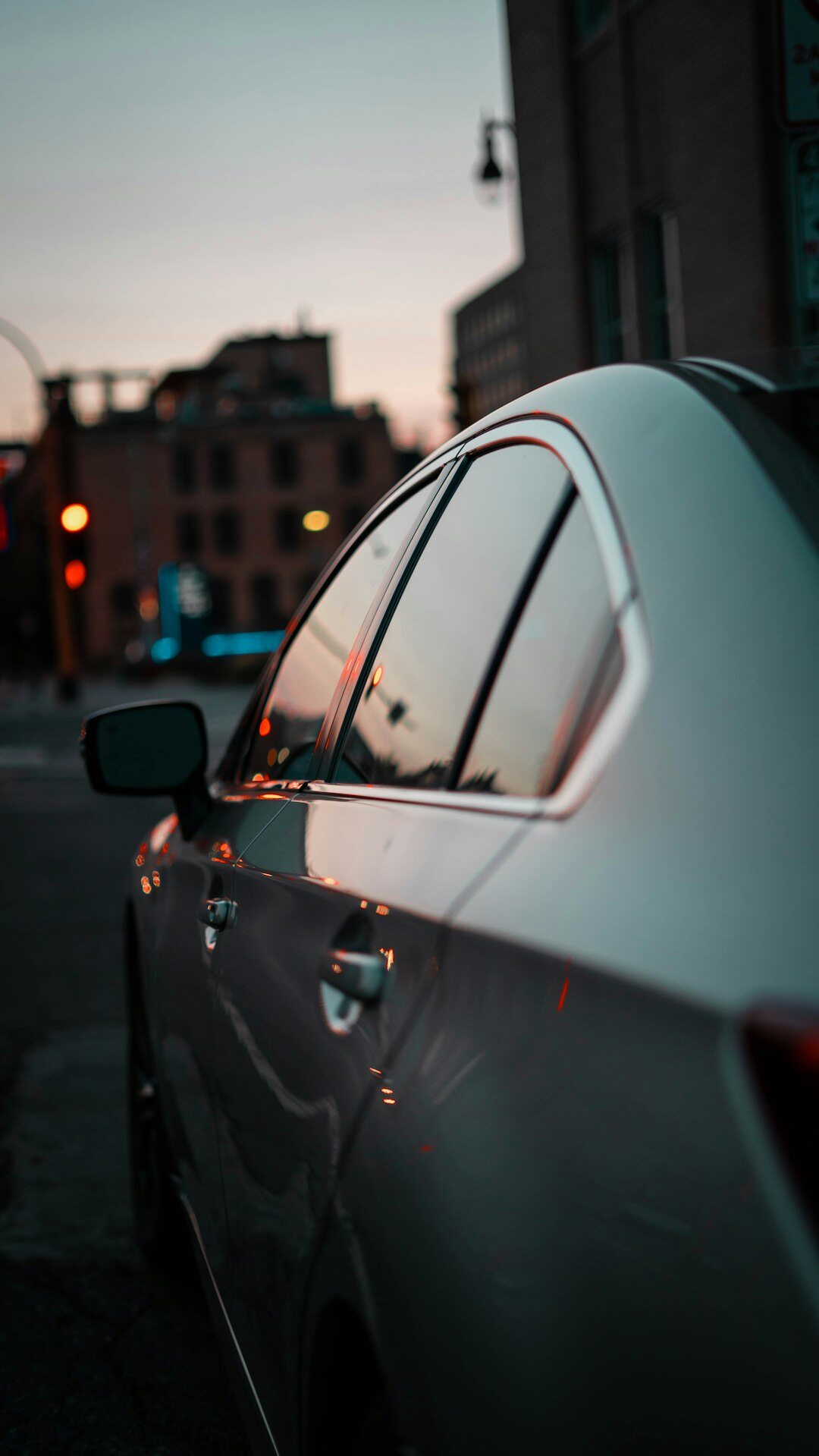 Silver sedan photographed at a low angle