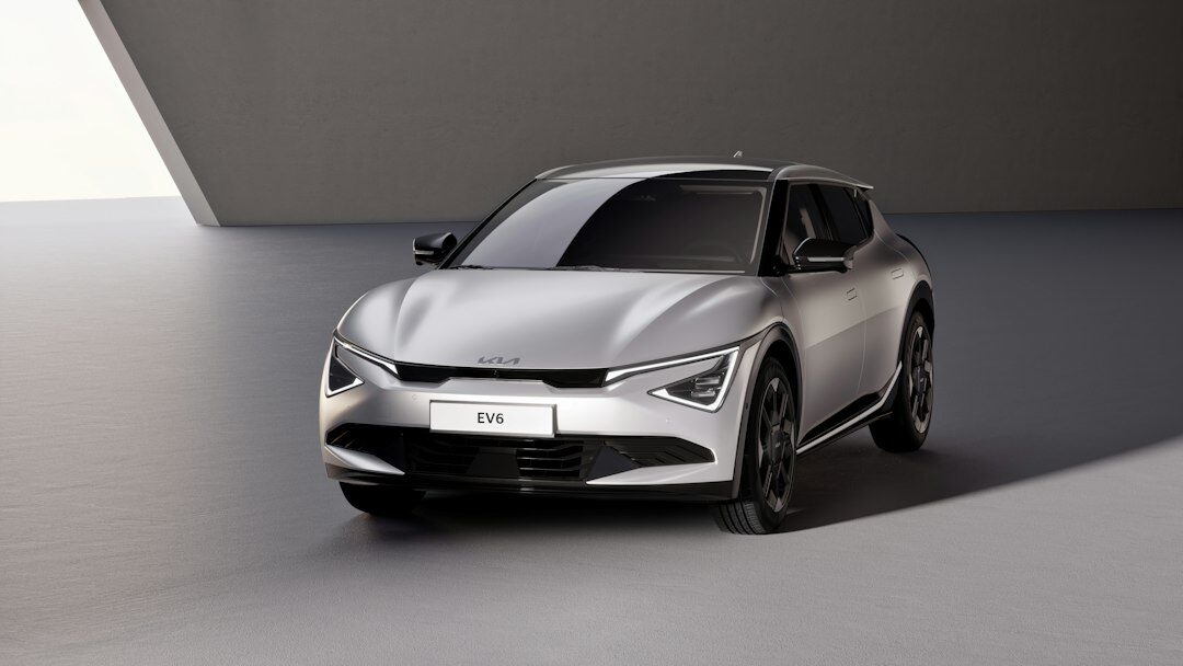 White electric hatchback in a modern studio