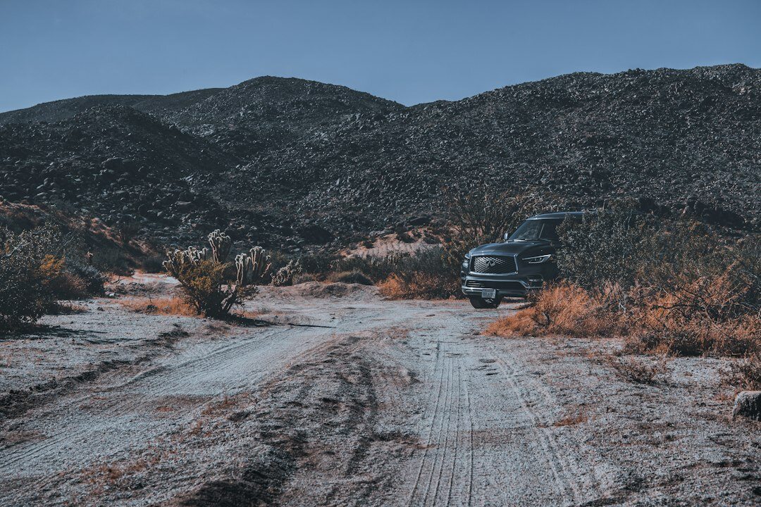 Grey 4x4 pickup truck on a dirt road
