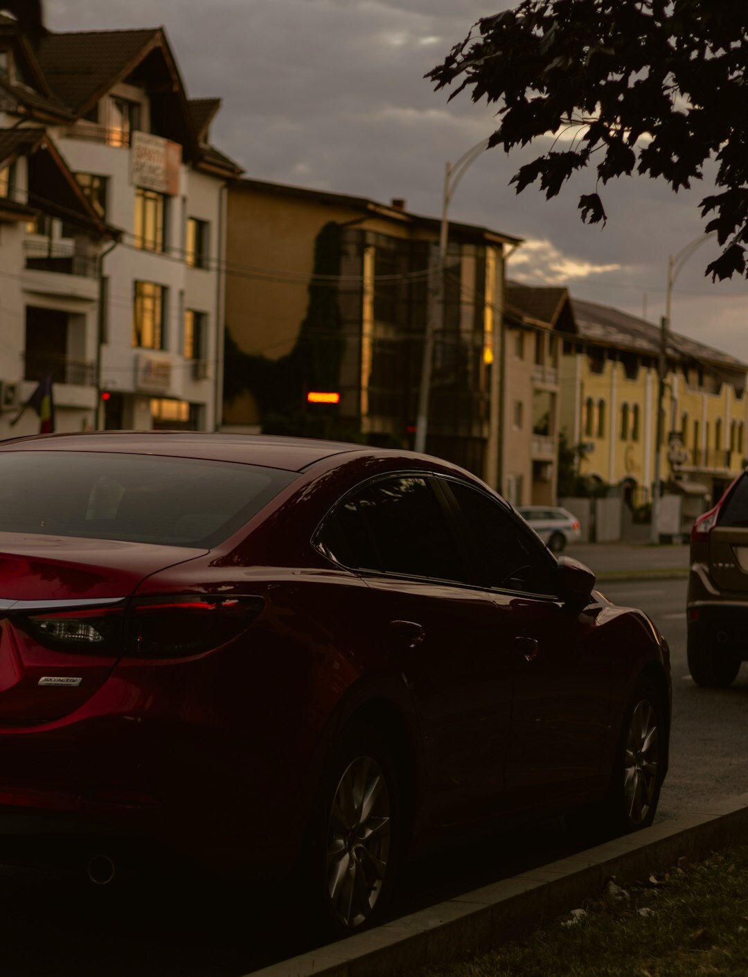 Car parked on a city street in the evening