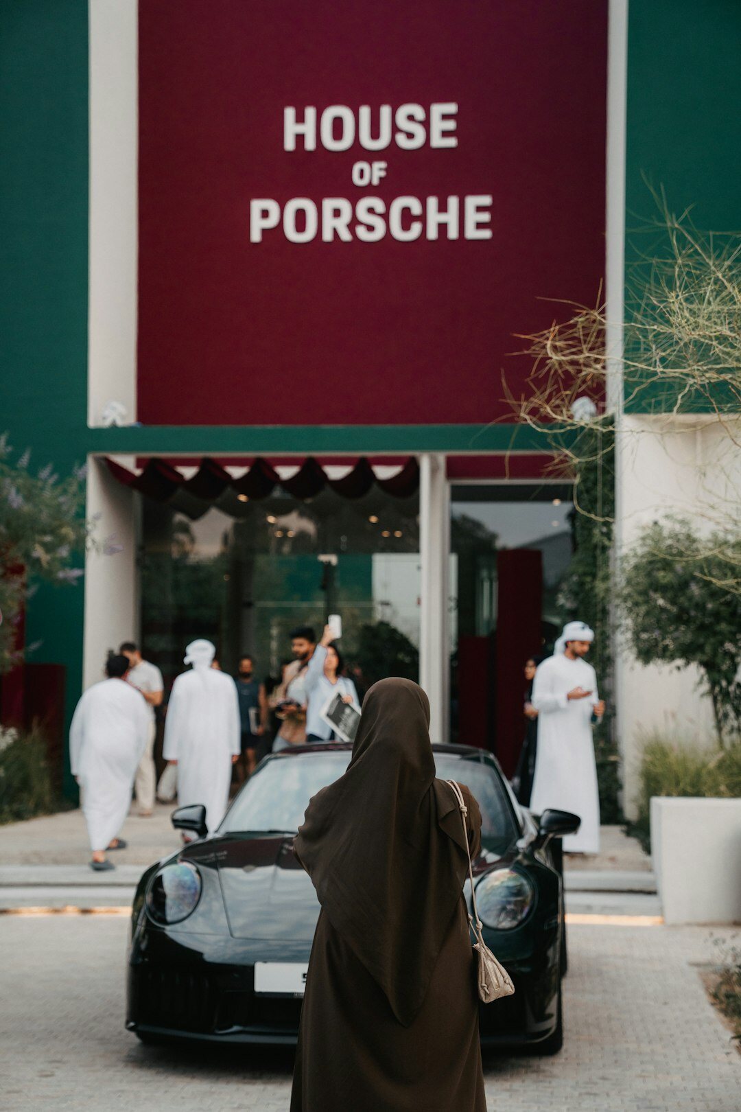 satisfied customers leaving car dealership