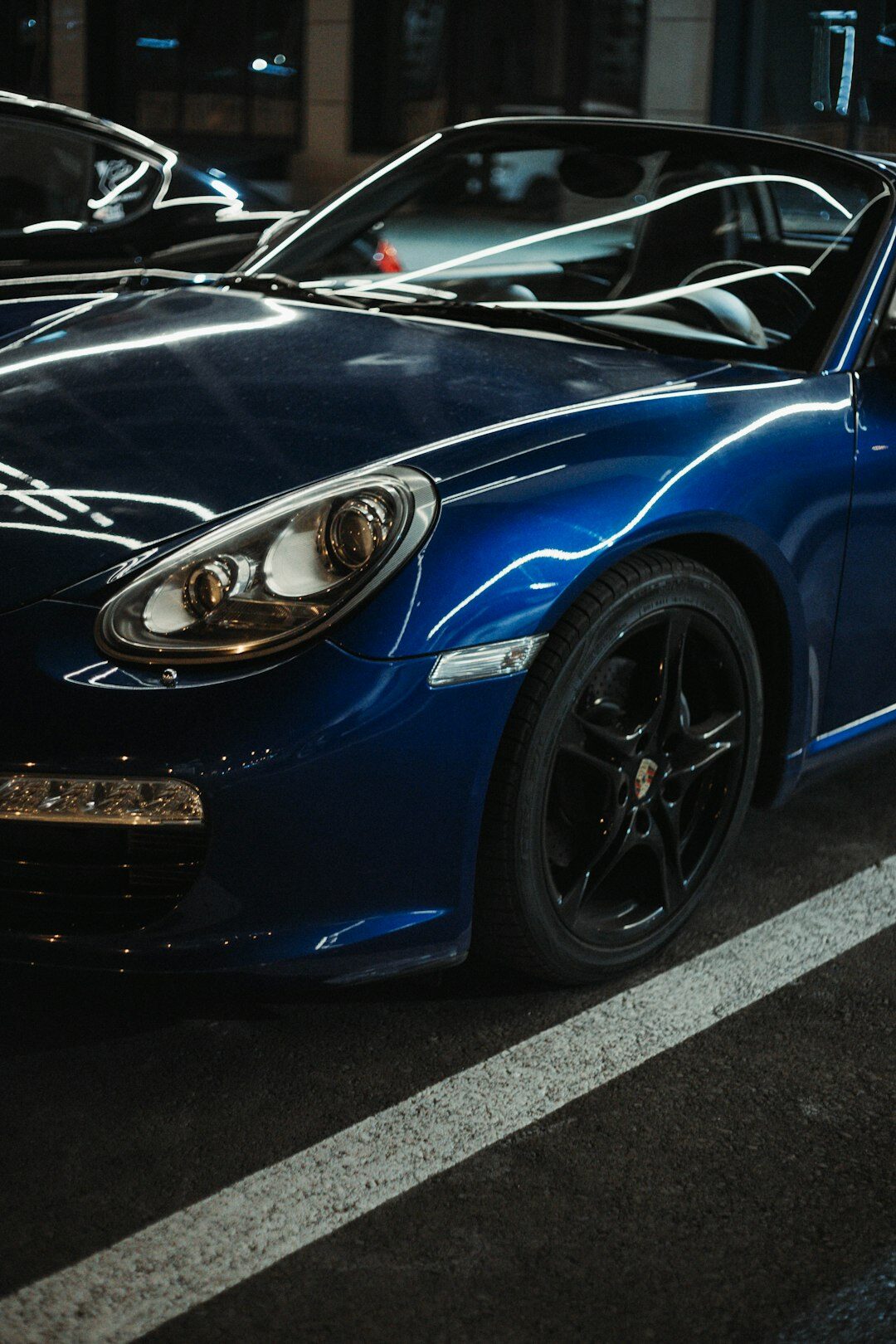 Blue sport sedan parked in an urban setting